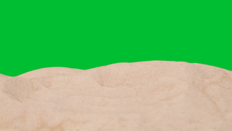 Summer-Holiday-Concept-With-Sandy-Beach-In-Foreground-Against-Green-Screen-1