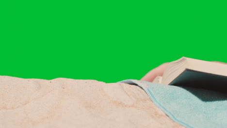 Summer-Holiday-Concept-Of-Person-On-Beach-Towel-Reading-Book-Against-Green-Screen-2