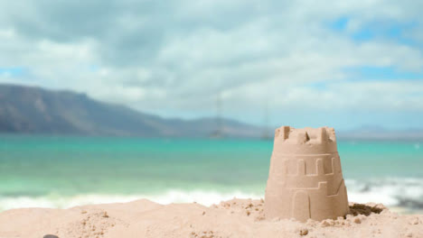 Summer-Holiday-Concept-Making-Sandcastle-On-Sandy-Beach-Against-Sea-Background-3
