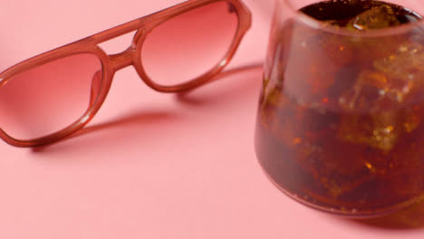 Summer-Holiday-Concept-Of-Sunglasses-And-Cold-Drink-On-Pink-Background-3
