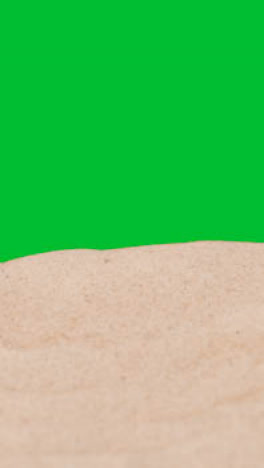 Vertical-Video-Summer-Holiday-Concept-With-Sandy-Beach-In-Foreground-Against-Green-Screen