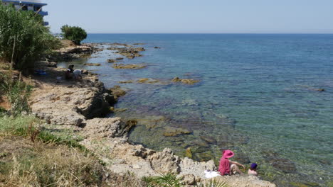 Greece-Crete-Aegean-Sea-With-Tourist-On-Rock