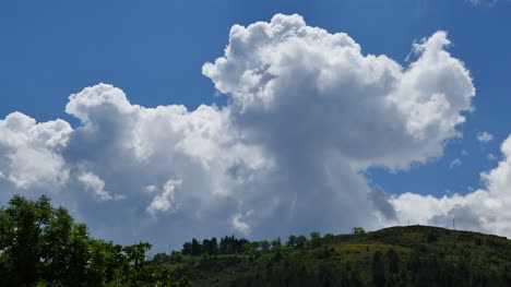 Spain-Pyrenees-A-Large-Cumulus-Cloud-Over-A-Hill