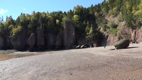 Canada-Man-Sits-On-A-Beach-At-Low-Tide-At-Hopewell-Rocks