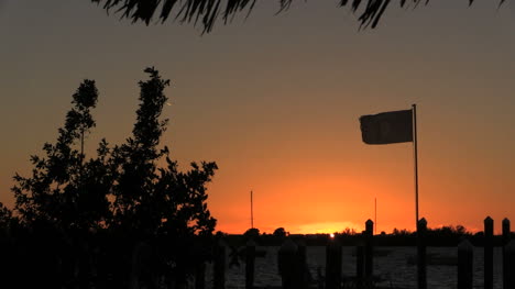 Florida-Key-Largo-Sunset-With-Flag-Blowing-In-Wind