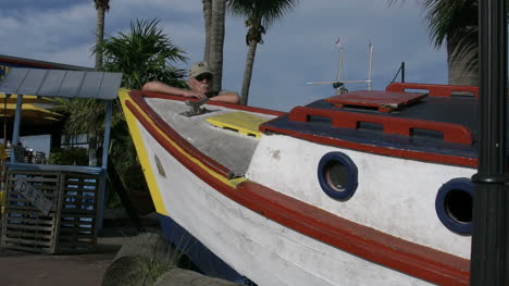 Florida-Key-West-Man-In-Cap-Leaning-On-Boat
