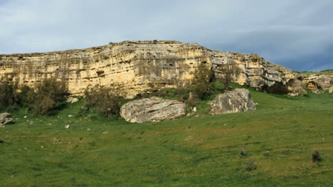 New-Zealand-Rocky-Cliff-With-Rocks-On-Slope