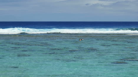 Rarotonga-Swimmer-And-Waves-On-Reef