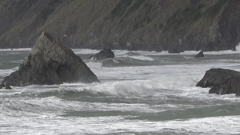 California-Waves-On-Rocks-By-Highway-Pan