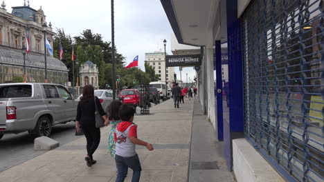 Chile-Punta-Arenas-Mother-With-Children-On-Sidewalk