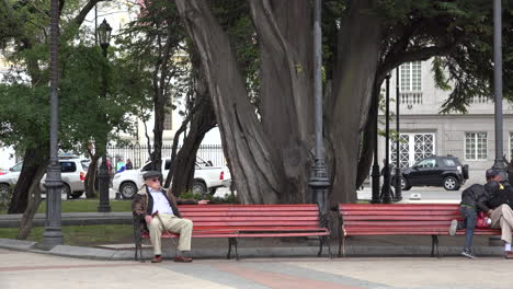 Chile-Punta-Arenas-Zooms-To-Man-On-Park-Bench