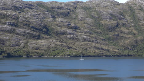 Chile-Smyth-Channel-Sailboat-On-Rugged-Coast