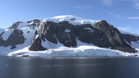 Antarctica-Big-Black-Cliff-With-Snow