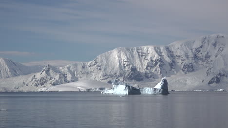 Antarctica-Iceberg-Floats-By-Cliffs