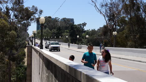 California-Family-Walking-On-Sidewalk