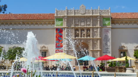 California-Fountain-With-Pink-Flowers-And-People