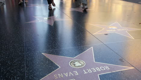 Los-Angeles-Tilts-Up-From-Feet-Walking-On-The-Hollywood-Walk-Of-Fame