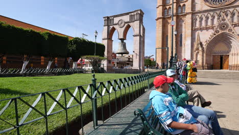 Mexico-Arandas-Men-On-Bench-With-Bell-In-Background