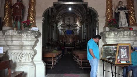 Mexico-Atotonilco-Man-Looks-At-Case-In-Church