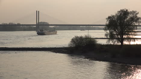 Germany-Rees-Barge-And-Bridge-Near-Sunset