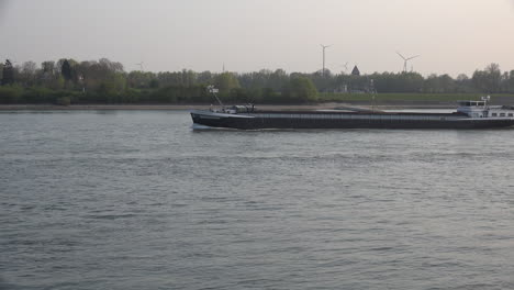 Germany-Rhine-At-Rees-Barge-With-Background-Wind-Turbine
