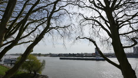 Netherlands-Barge-Appears-Between-Trees-On-The-Lek-River