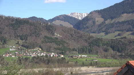 Switzerland-Distant-Village-And-Alps