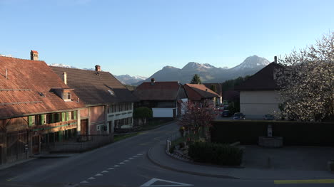 Switzerland-Town-With-Car-And-Mountains