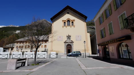 France-Church-In-Jausiers-With-Traffic