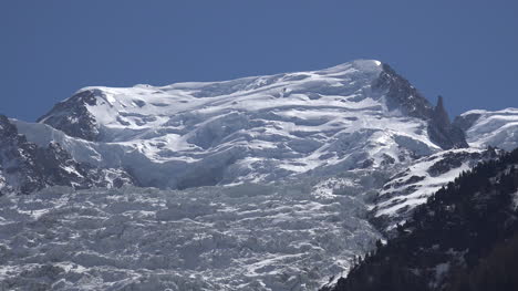 France-Les-Bossons-Zooms-Out-To-Glacier-Seen-Between-Houses