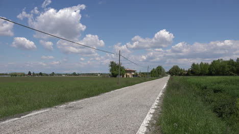 Italy-Bicycler-On-Country-Road-In-Flatlands