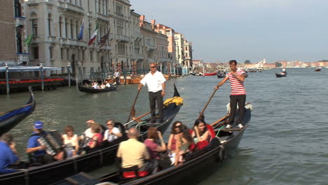 Venice-Three-gondolas-full-of-tourists