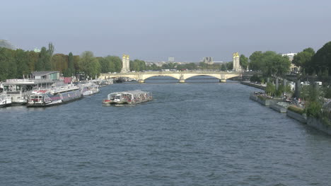 Paris-Seine-with-a-tour-boat-and-bridge