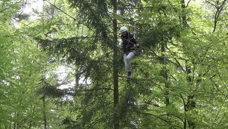 Austria-woman-walks-on-rope-ladder