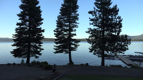 California-Almanor-Lake-with-trees-by-lake-zooms-in