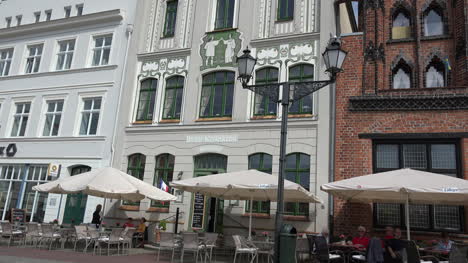 Germany-Wismar-building-with-painting-of-dancers