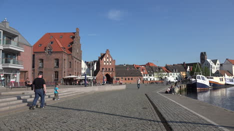 Germany-Wismar-cobblestone-street-by-waterfront