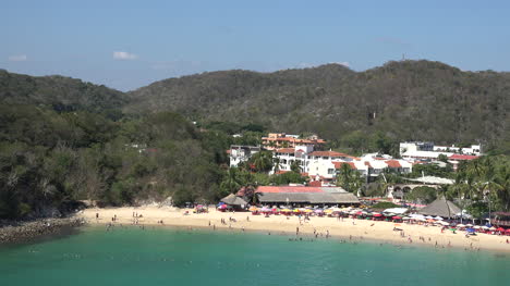 Mexico-Huatulco-beach-and-town-pan-right