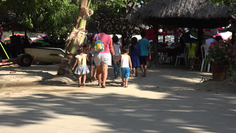 Mexico-Huatulco-family-walking-in-shade