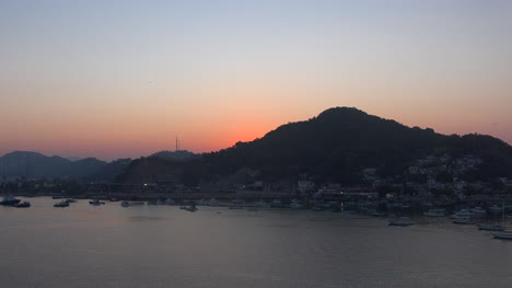 Mexico-Manzanillo-hills-above-waterfront-before-dawn-pan