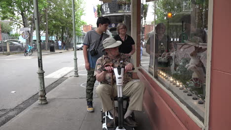 New-Orleans-man-on-scooter-with-woman-and-teen