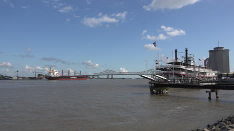 New-Orleans-ship-approaches-bridge-past-steamboat