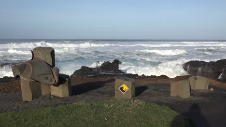 Oregon-coast-with-monument-and-warning-sign