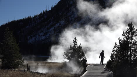 Yellowstone-man-on-boardwalk-with-stream