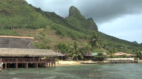 Moorea-thatched-building-and-peak-on-Cook's-Bay