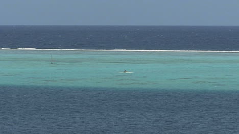 Raiatea-man-paddles-inside-reef-2