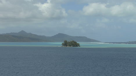 Raiatea-zooms-from-island-in-lagoon
