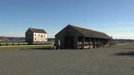 Massachusetts-Salem-boat-shed-walking-dog-sx