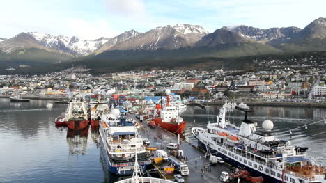 Argentina-Ushuaia-mountains-behind-harbor-with-ships