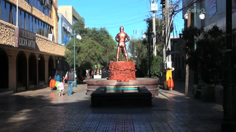 Chile-Calama-statue-miner-on-red-base-and-fountain-5